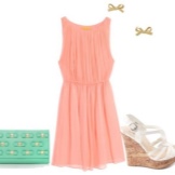 Peach dress with green bag