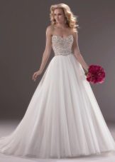 Magnificent wedding dress with the decorated corset