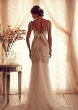 Wedding dress from the collection of Gossamer from Anna Campbell with an open back