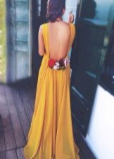 Mustard dress with open back and roses