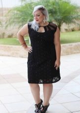 Fashionable black dress for a full woman of short stature