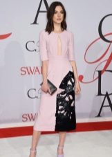 Pink dress with black clutch