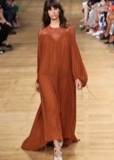 Long fluffy terracotta dress made of translucent fabric