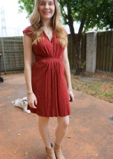 Terracotta dress of medium length for a blonde blonde