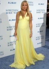 Long yellow dress on the floor for pregnant women