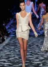 Dress with ruffles in the form of peplum