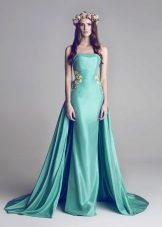 Turquoise dress with a train and open shoulders