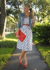 White dress in blue polka dots in combination with red accessories