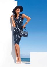 Business navy dress with polka dots and a bag