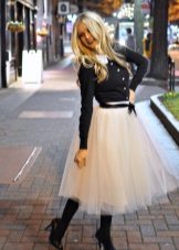 Full skirt in combination with a leather jacket