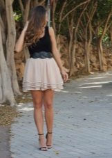 Layered beige skirt in combination with a black T-shirt