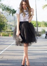 Layered black skirt in combination with a t-shirt