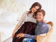 Photo session of a pregnant woman with her husband in a photo studio