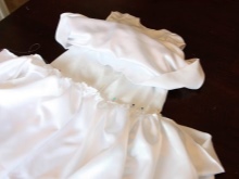 A skirt attachment to the baptismal bodice