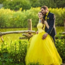 Yellow wedding dress with the groom's outfit