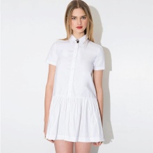 White short polo dress with a pleated skirt