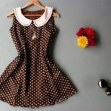 Short brown dress with white polka dots and white collar