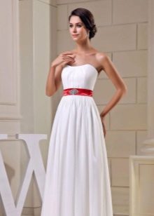 Wedding dress with a wide red belt and decorations