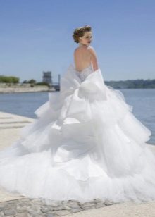 Magnificent wedding dress with a cascading skirt and train