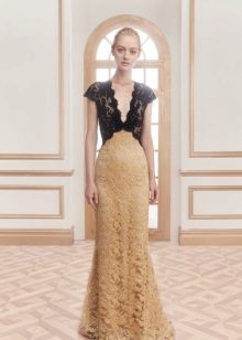 Long evening dress from different types of guipure
