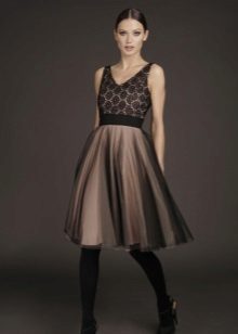 Evening dress with a guipure top short