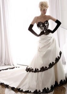 wedding dress with black lace at the edges of the skirt