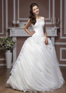 A wedding dress from the Hadassa Diamond Collection with a multi-layered skirt