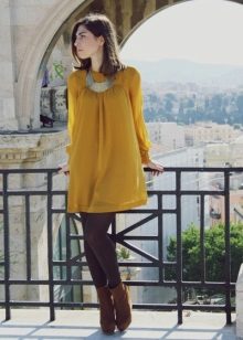 Brunette in mustard dress