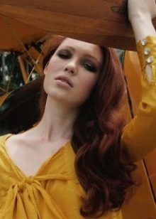 Red-haired girl in a mustard dress