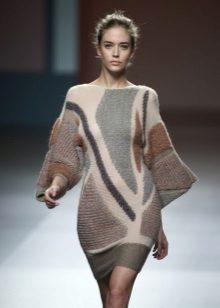 Knitted dress with sleeves on the machine