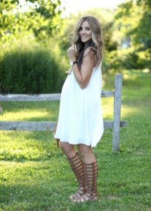 White dress of a cold shade for pregnant women