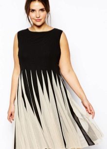 Dress with a pleated skirt medium length concealing protruding belly