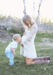 White dress for a photo shoot pregnant - son kisses his tummy