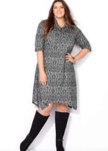 Gray knitted dress of medium length with trapeze for full length