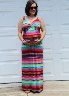 Color long dress on the floor on shades for pregnant women