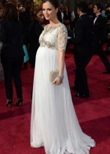 Long white dress on the floor with a sleeve to the elbow for pregnant women