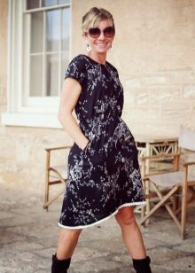 Black dress from the staple with a small floral print midi length
