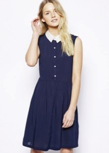 A fitted short blue shirt dress with a white collar