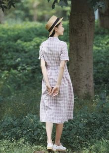 White elongated plaid shirt dress and hat