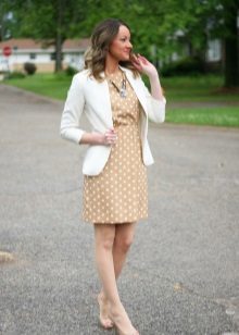 Beige office dress with white polka dots in combination with a white jacket