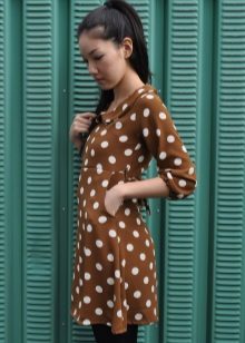 Brown dress in white large peas with a three-quarter sleeve