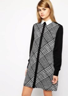 Black and white squirt dress with a white collar and black long sleeves