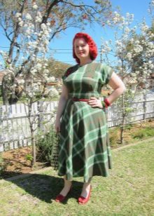 Green dress in a cage with a fluffy skirt for obese women