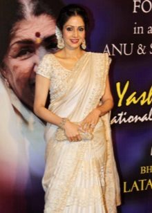 Clutch to white saree