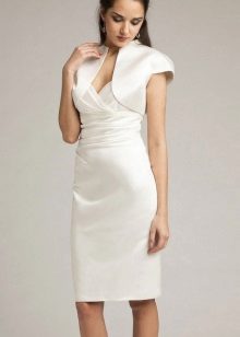 Strict wedding dress sheath of medium length in combination with ballero