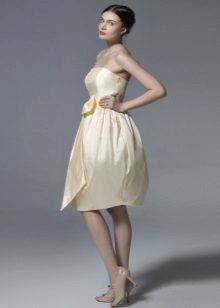 Elegant beige bustier dress with a bell skirt