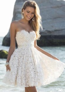White lace bustier dress with a sun skirt