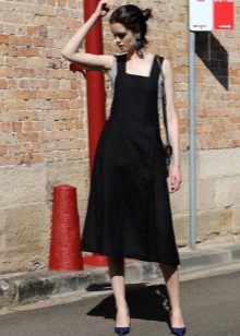 Black dress sundress of medium length with a free skirt