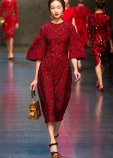 Red lace dress with gold accessories