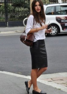 Black pencil skirt in combination with a white loose cut blouse
